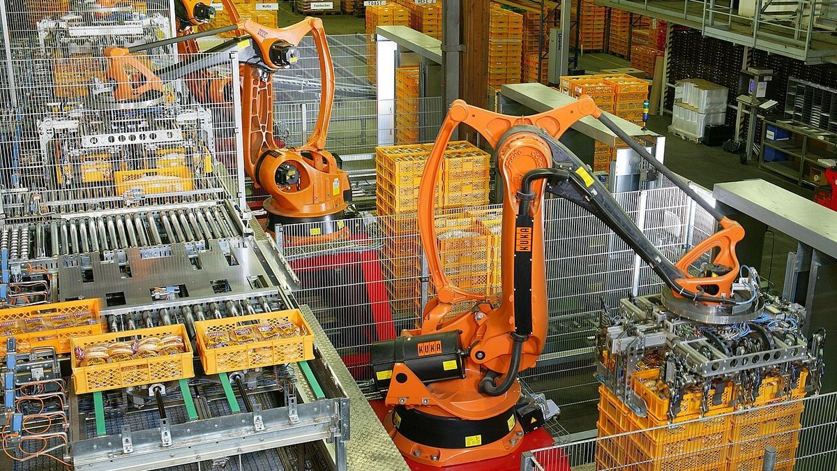 Automated food manufacturing facility with stainless steel handling equipment and sanitary conveyor lines